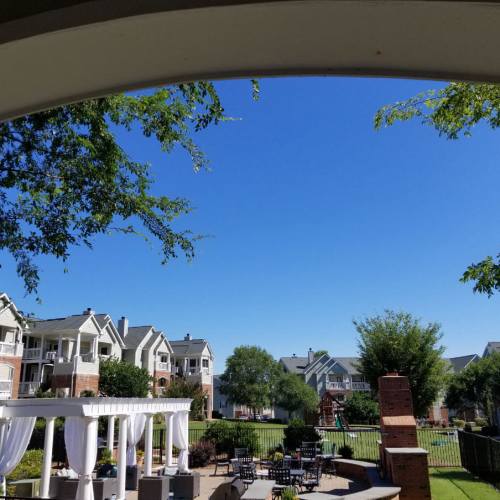 Apartment community exterior with landscaped grounds at Village at Lake Wylie in Lake Wylie, South Carolina