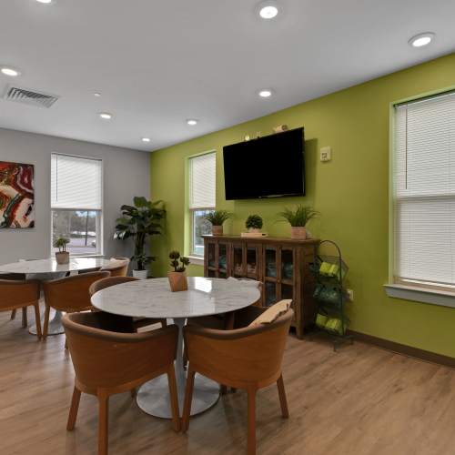 Seating area with a television at The Edge in Pensacola, Florida