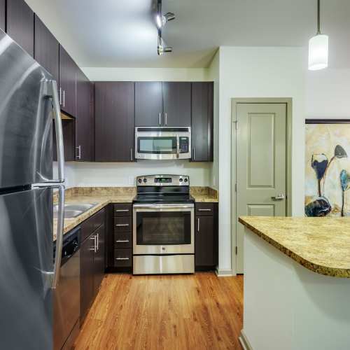 Modern kitchen with fridge at Vistas At 707 in Charlotte, North Carolina