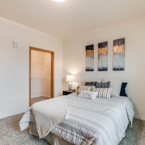 Cozy bedroom with comfortable bed at Eva Manor in Pleasant Prairie, Wisconsin