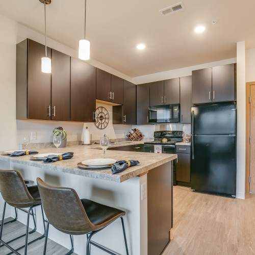 View of well-lit apartment kitchen at Eva Manor in Pleasant Prairie, Wisconsin