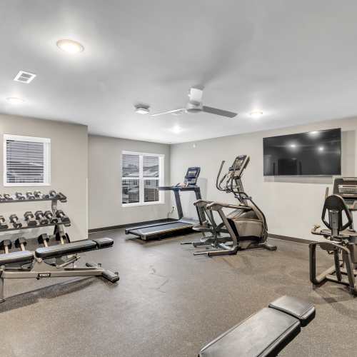 Fitness center with television at Union Court Senior Apartments and Townhomes in Kenosha, Wisconsin
