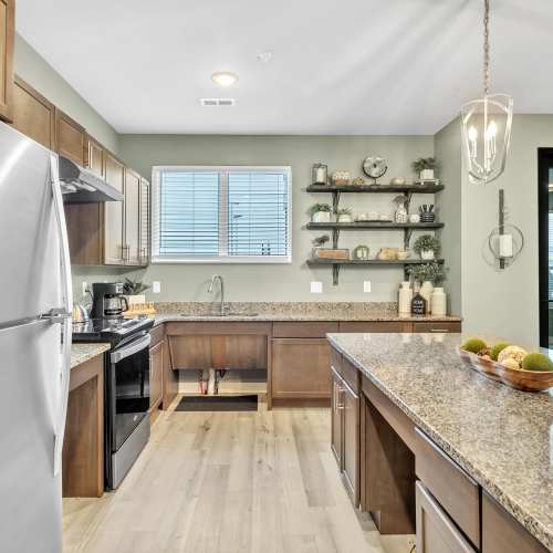 Clubhouse kitchen with granite countertop at Union Court Senior Apartments and Townhomes in Kenosha, Wisconsin