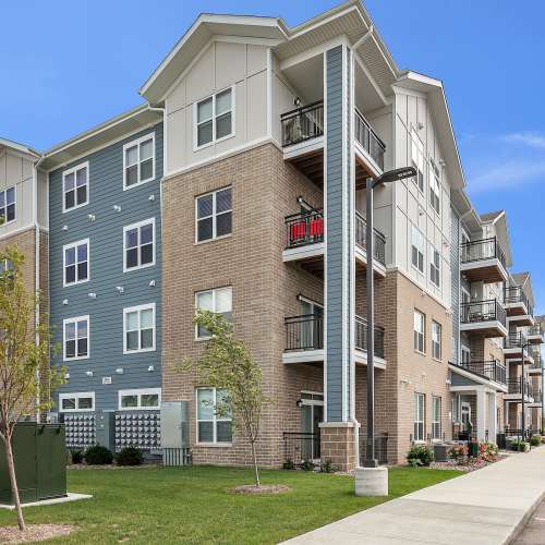 Community exterior view with lawn area at Union Court Senior Apartments and Townhomes in Kenosha, Wisconsin