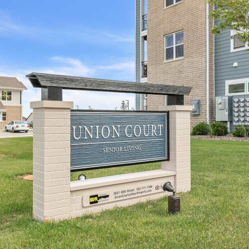 Community signage board at Union Court Senior Apartments and Townhomes in Kenosha, Wisconsin