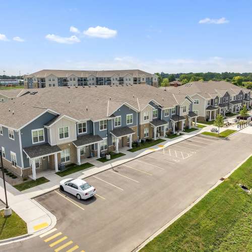 Community exterior view with parking slot at Union Court Senior Apartments and Townhomes in Kenosha, Wisconsin