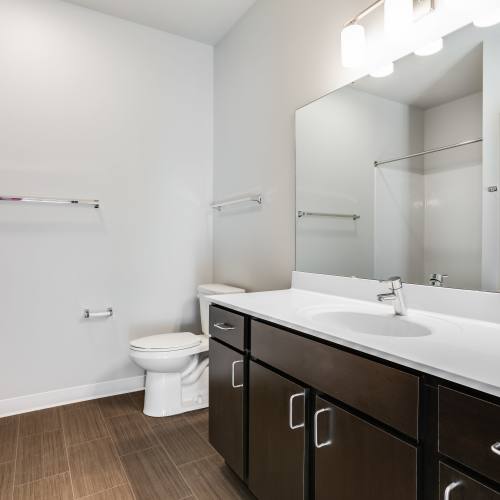 Bathroom with commode at Union Court Senior Apartments and Townhomes in Kenosha, Wisconsin