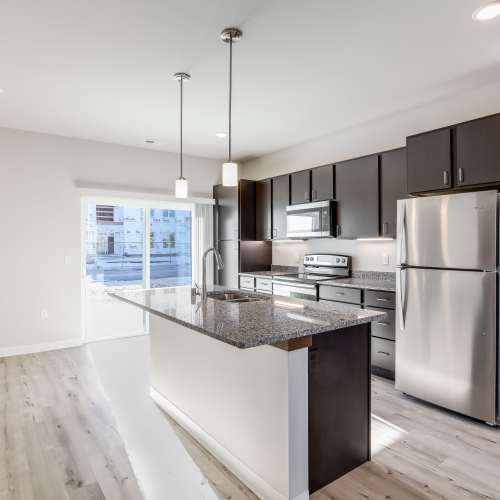 Kitchen with attached patio at Union Court Senior Apartments and Townhomes in Kenosha, Wisconsin