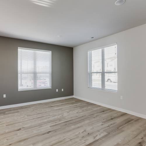 Living room with wooden flooring at Union Court Senior Apartments and Townhomes in Kenosha, Wisconsin