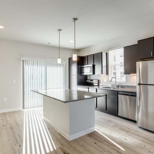 Kitchen with granite counter top at Union Court Senior Apartments and Townhomes in Kenosha, Wisconsin