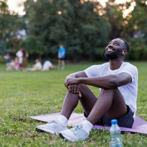 A man relaxing in a park near Waterford Place Apartments in Mesa,Arizona