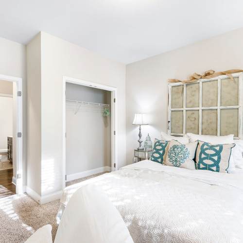 Bedroom in a model home at The Apartments at Shade Tree in Johns Island, South Carolina
