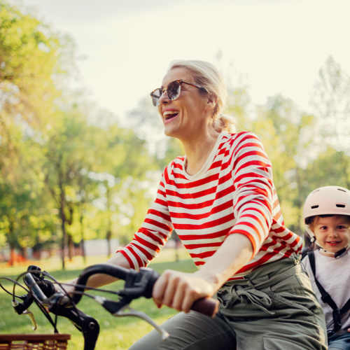 Woman biking with her kid near Reserve at Northshore in Lynn Haven, Florida