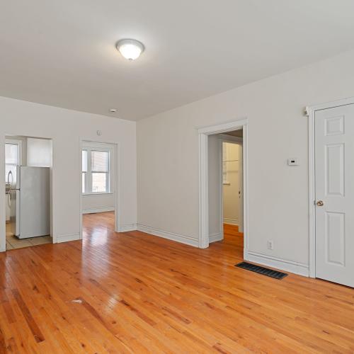 Unfurnished living space with windows in a model apartment at Central West End Apartments in Saint Louis, Missouri