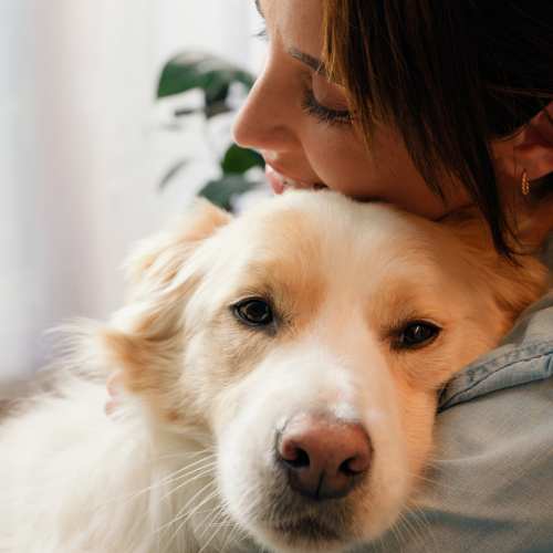Resident with her dog at River Run Village in San Diego, California