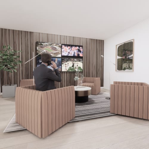 Media lounge with multiple screens and contemporary armchairs at Evergreen Westside in Gainesville, Florida.