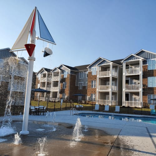 Resort-style swimming pool with lounge seating at Groves at Berry Creek in Duncan, South Carolina