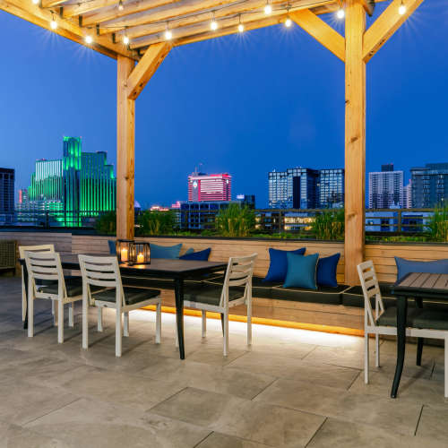 Happy residents in their living room at Eden Tower Apartments in Reno, Nevada
