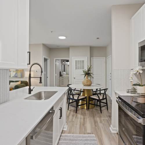 View of the dining area from the kitchen at Flatiron West Trade in Charlotte, North Carolina