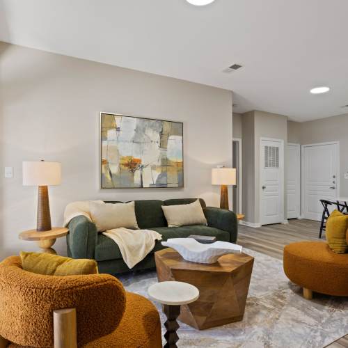 Living room with a comfortable couch at Flatiron West Trade in Charlotte, North Carolina