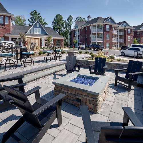 Outdoor fire pit with chairs at Seasons at Bennett's Creek in Gastonia, North Carolina