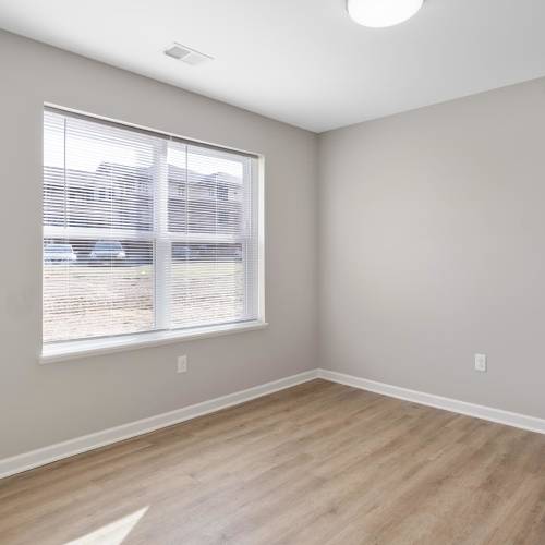 Modern and well-lit bedroom at Trolley Circle in Belleville, Illinois