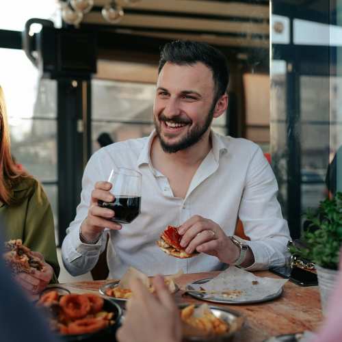 Resident having food and drinks in restaurant near Haven + Arrow in Rancho Cucamonga, California 
