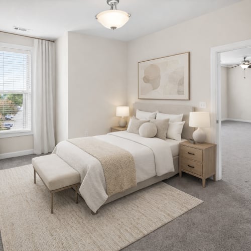 Spacious apartment bedroom with natural light at Ballantyne Commons of Hendersonville in Hendersonville. NC