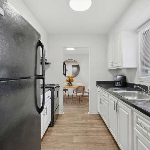 Apartment kitchen with a window over the sink at Costa Del Lago in Lake Worth, Florida