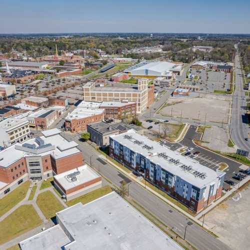 Aerial view of buildings and parking near Five Points Crossing in Rocky Mount, North Carolina