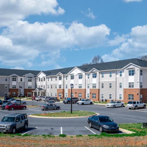 Building exterior with parking area at Landon Greene in Statesville, North Carolina