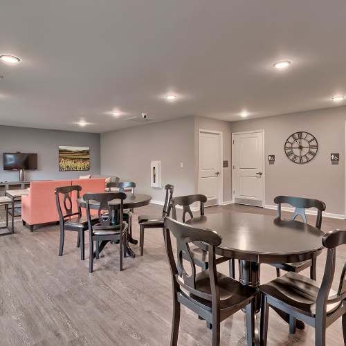 Community lounge with seating and TV at Lowcountry Crossing in Denmark, South Carolina