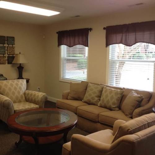 A view of the couch in a living room at West Downs in Charlotte, North Carolina