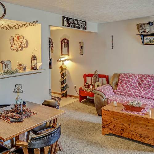 Cozy living room with dining area at Glennview Apartments in Washington Court House, Ohio