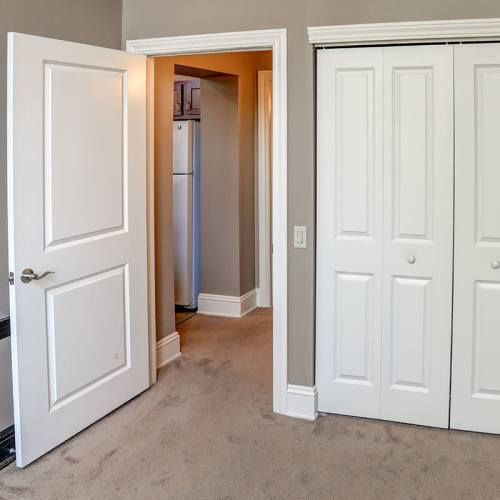 Bedroom with closet and doorway at Washington School Apartments in Washington Court House, Ohio