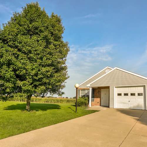 Single-story home with garage at Leewood Place in Fremont, Ohio