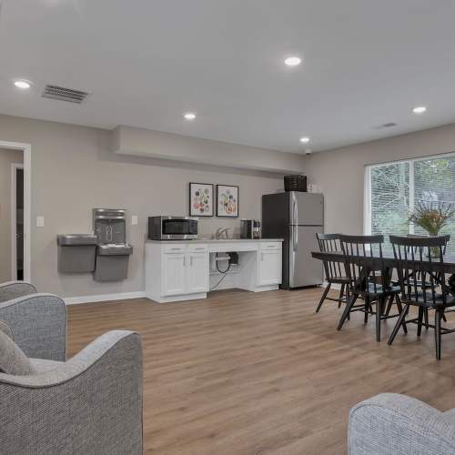 Community lounge with kitchen area at Plumly Townhomes in Barnesville, Ohio