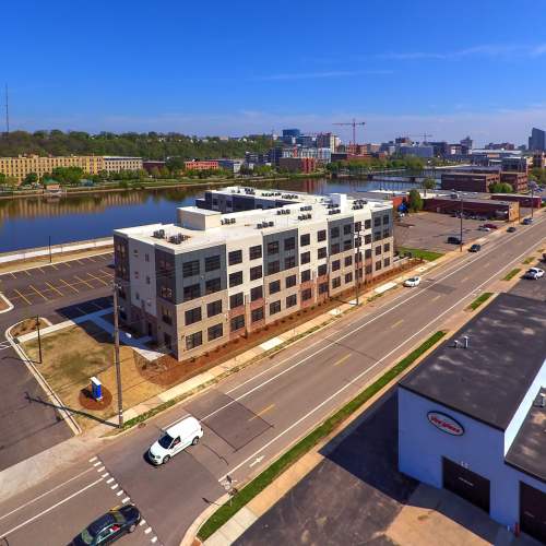 Modern apartment community with scenic river views and ample parking spaces at Grand View Place in Grand Rapids, Michigan