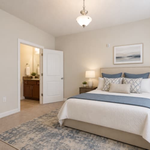 Furnished bedroom at Seasons at Cane Creek in Fletcher, North Carolina