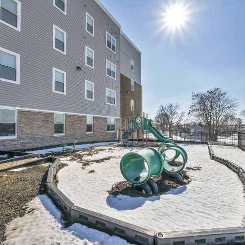 Resident playground area with slides at Newton Family Apartments in Canton, Ohio