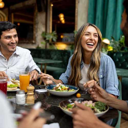 Friends having food at a restaurant near City View Lofts in Richmond, Virginia