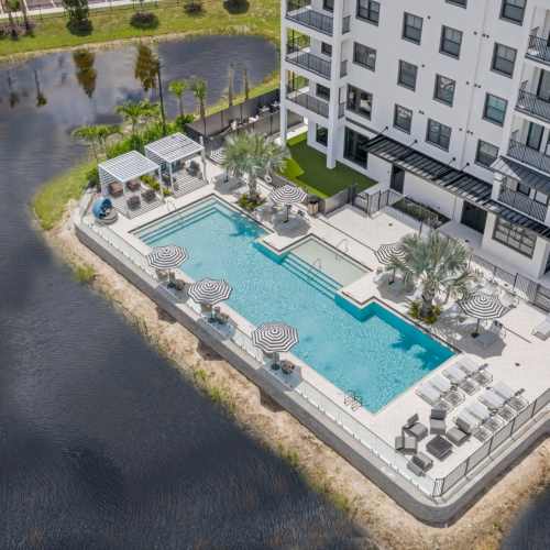 evergreen-pine-island-cape-coral-fl-pool-with-surrounding-pond 