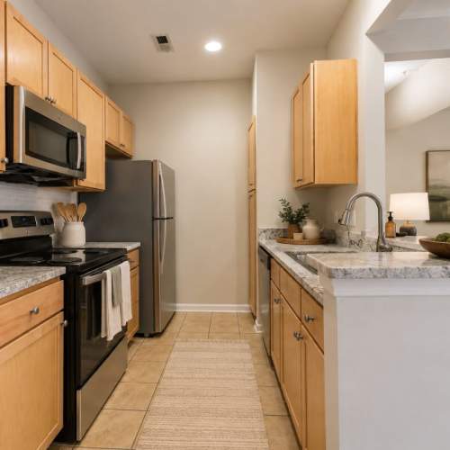 A kitchen with appliances in a home at Atkins Circle Apartments & Townhomes in Charlotte, North Carolina