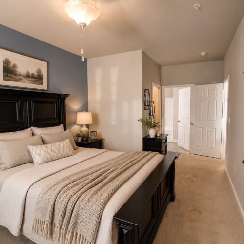 Comfortably furnished bedroom in a model home at Villas at Fort Mill in Fort Mill, South Carolina