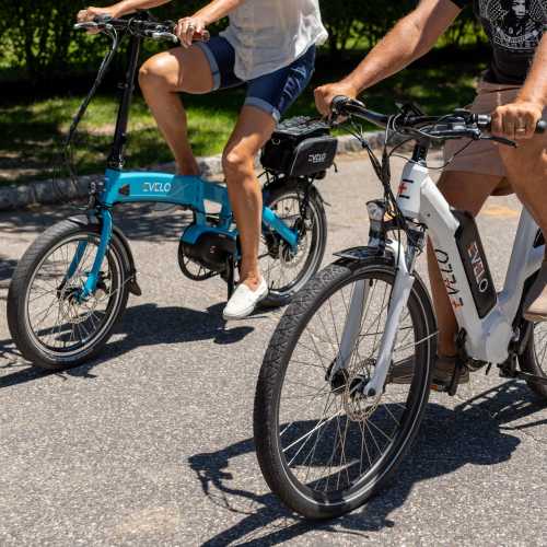 Cyclists riding electric bikes at a community path Lakeside Villas in Baton Rouge, Louisiana