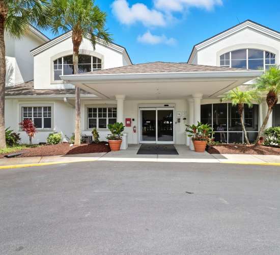 Landscaped walking path at Truewood by Merrill, Charlotte Center in Port Charlotte, Florida.
