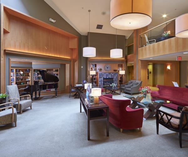 Main lobby with a piano at All Seasons of Rochester Hills in Rochester Hills, Michigan