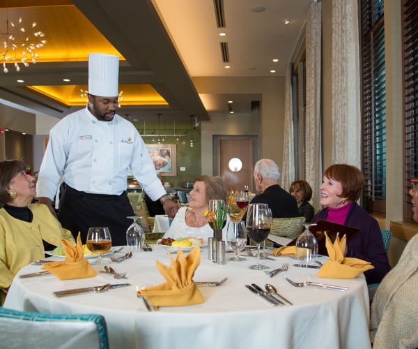 Resident enjoying a fresh cooked meal at All Seasons Rochester Hills in Rochester Hills, Michigan