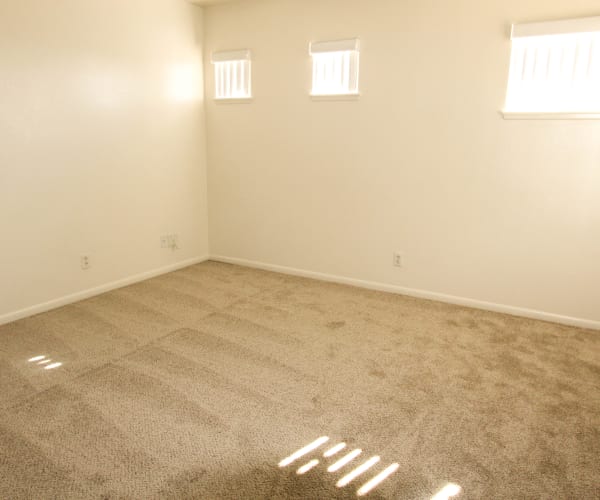 A bedroom in a home at Chesterton Townhomes in San Diego, California