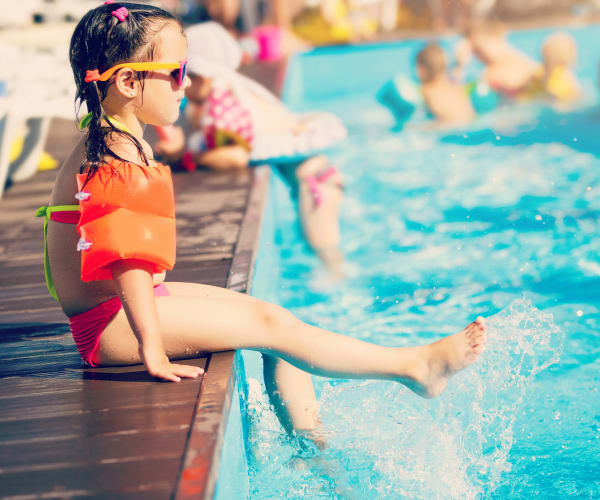 a girl on the edge of a swimming pool at Arundel Estates in Annapolis, Maryland